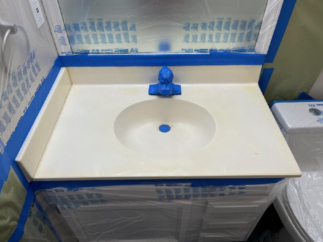 Applying new finish to bathroom countertop in High Point