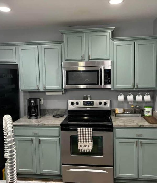 Cabinet refinishing in progress in a High Point kitchen with sanding and preparation work