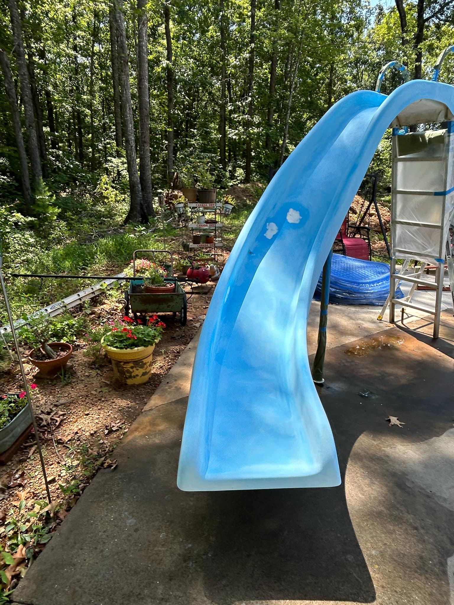 Technician repairing pool slide in Charlotte